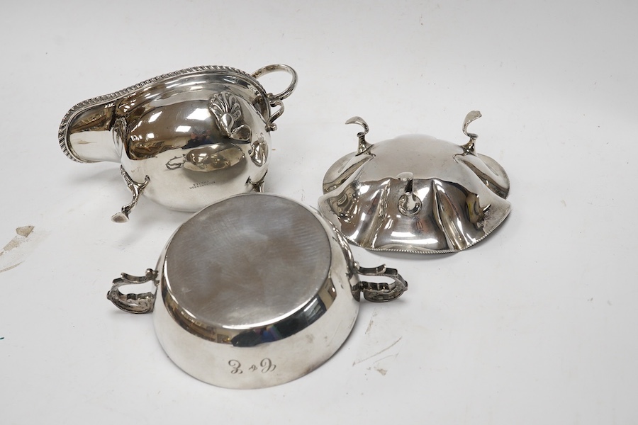 A silver quaich, E J Gallichan & Co Ltd, Sheffield, 1962, diameter 10.2cm, together with a silver sauceboat and a small silver dish, 10.1oz. Condition - fair